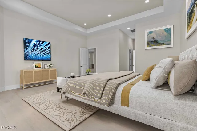 a bedroom with a bed and a couch