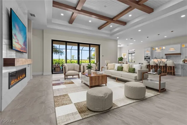 a living room with fireplace furniture and a flat screen tv