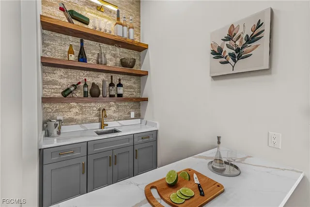 a kitchen with a sink and cabinets