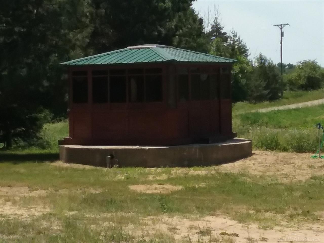 5162 Montgomery Road Marlette, MI 48453 - Photo 4 of 22 Enclosed hot tub of the west side of the home