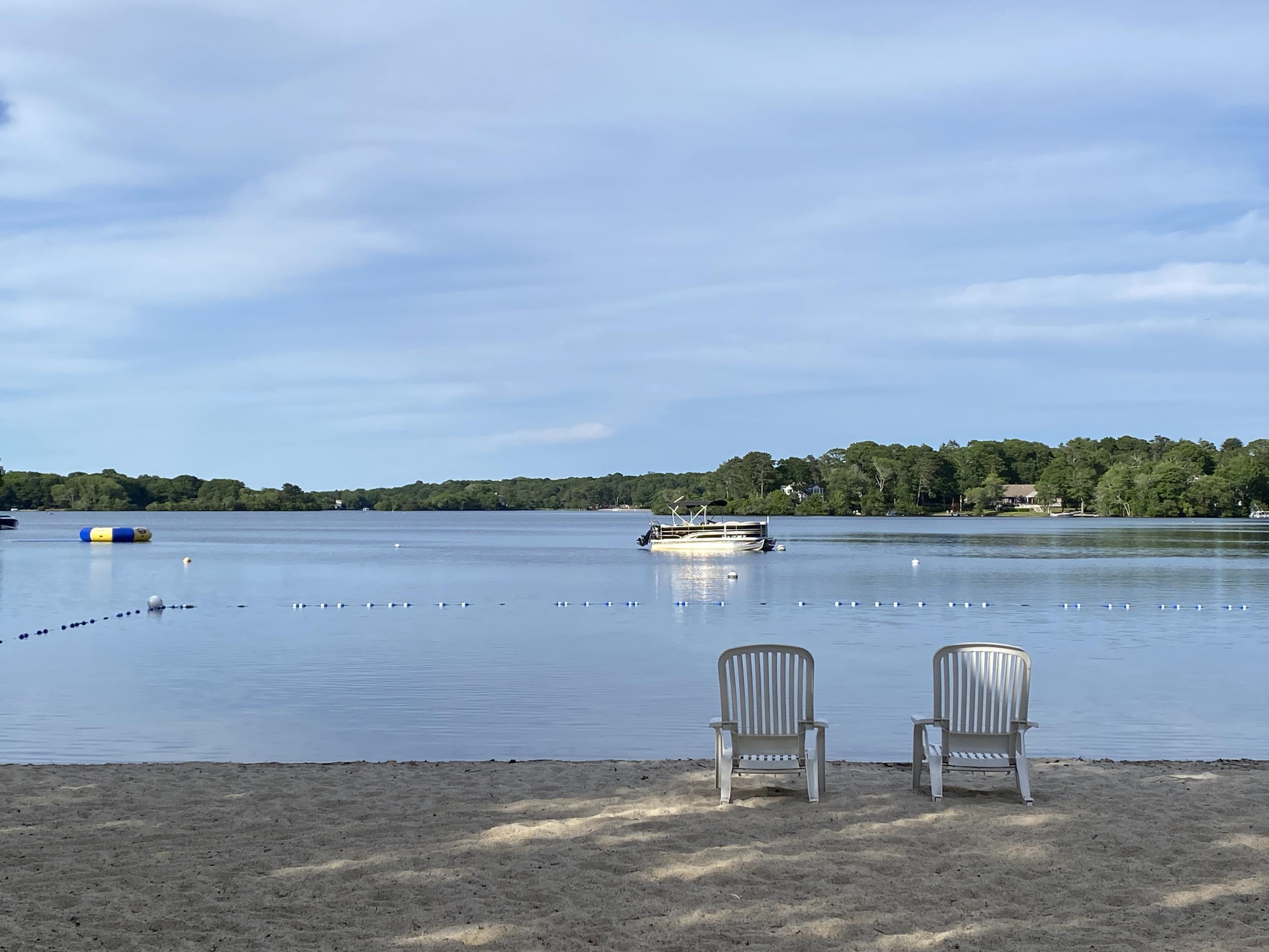 a view of a lake with table and chair