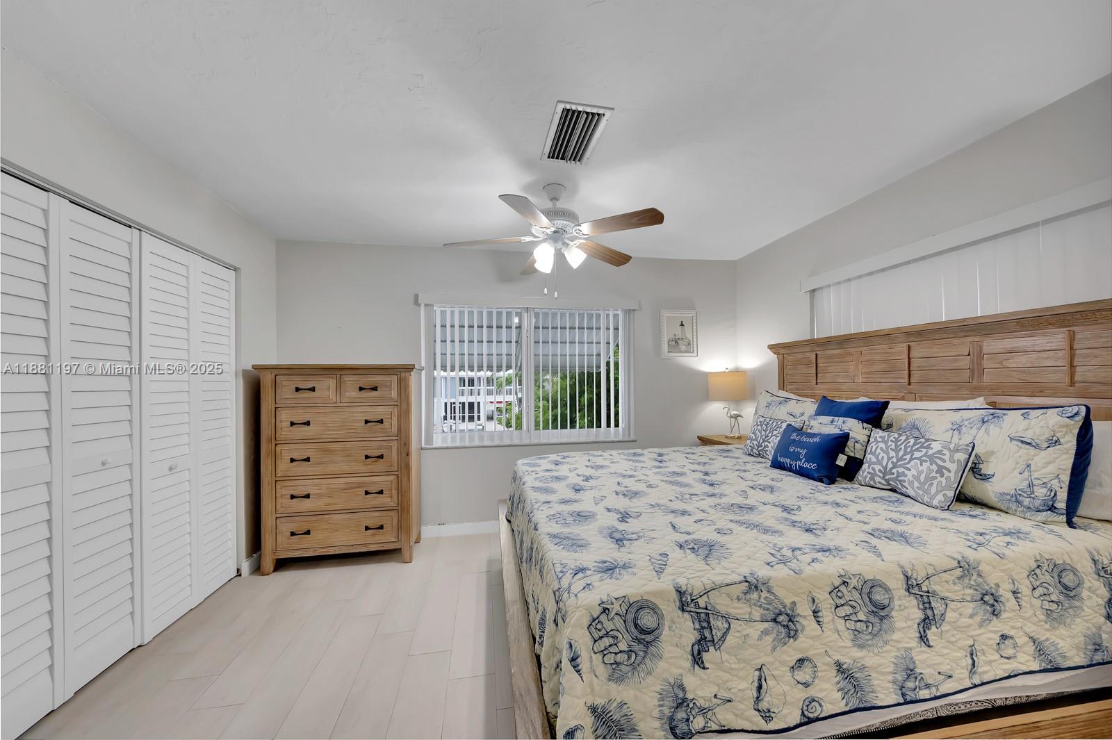 308 Sombrero Beach Road Marathon, FL 33050 - Photo 17 of 43 a bedroom with a large bed and a window