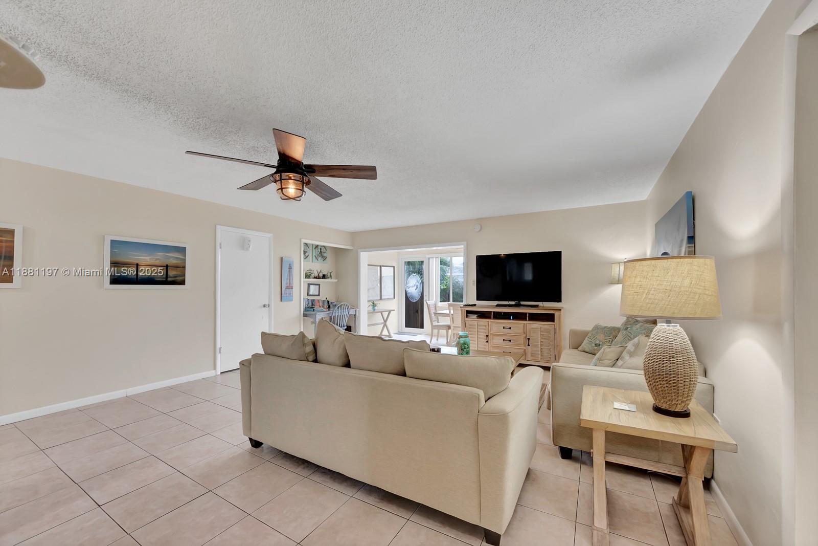 308 Sombrero Beach Road Marathon, FL 33050 - Photo 34 of 43 a living room with furniture and a flat screen tv