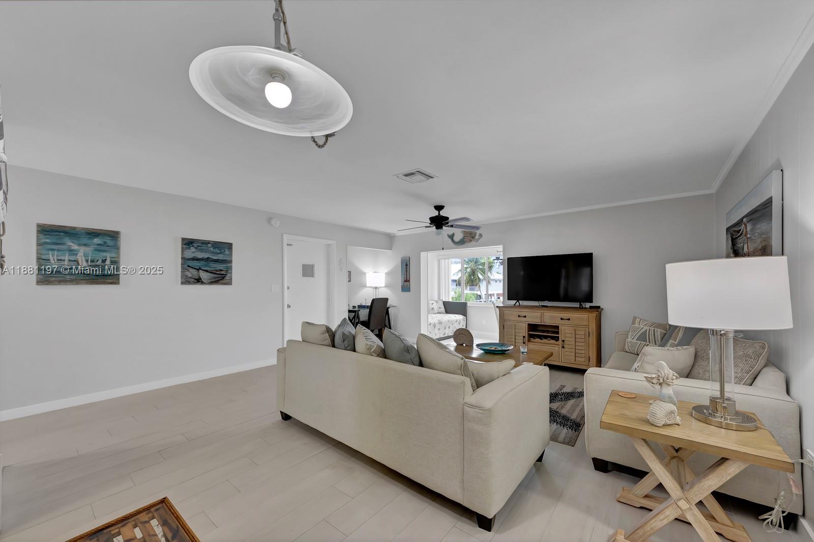 308 Sombrero Beach Road Marathon, FL 33050 - Photo 5 of 43 a living room with furniture and a flat screen tv