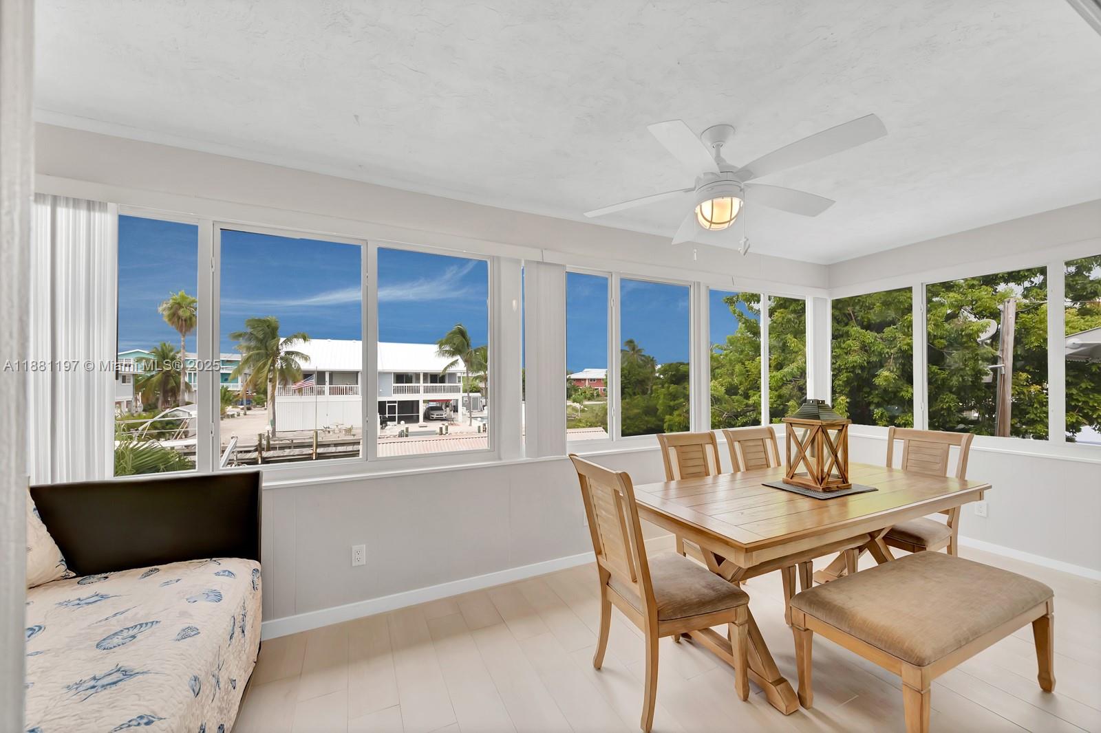 308 Sombrero Beach Road Marathon, FL 33050 - Photo 7 of 43 a dining room with furniture and a large window