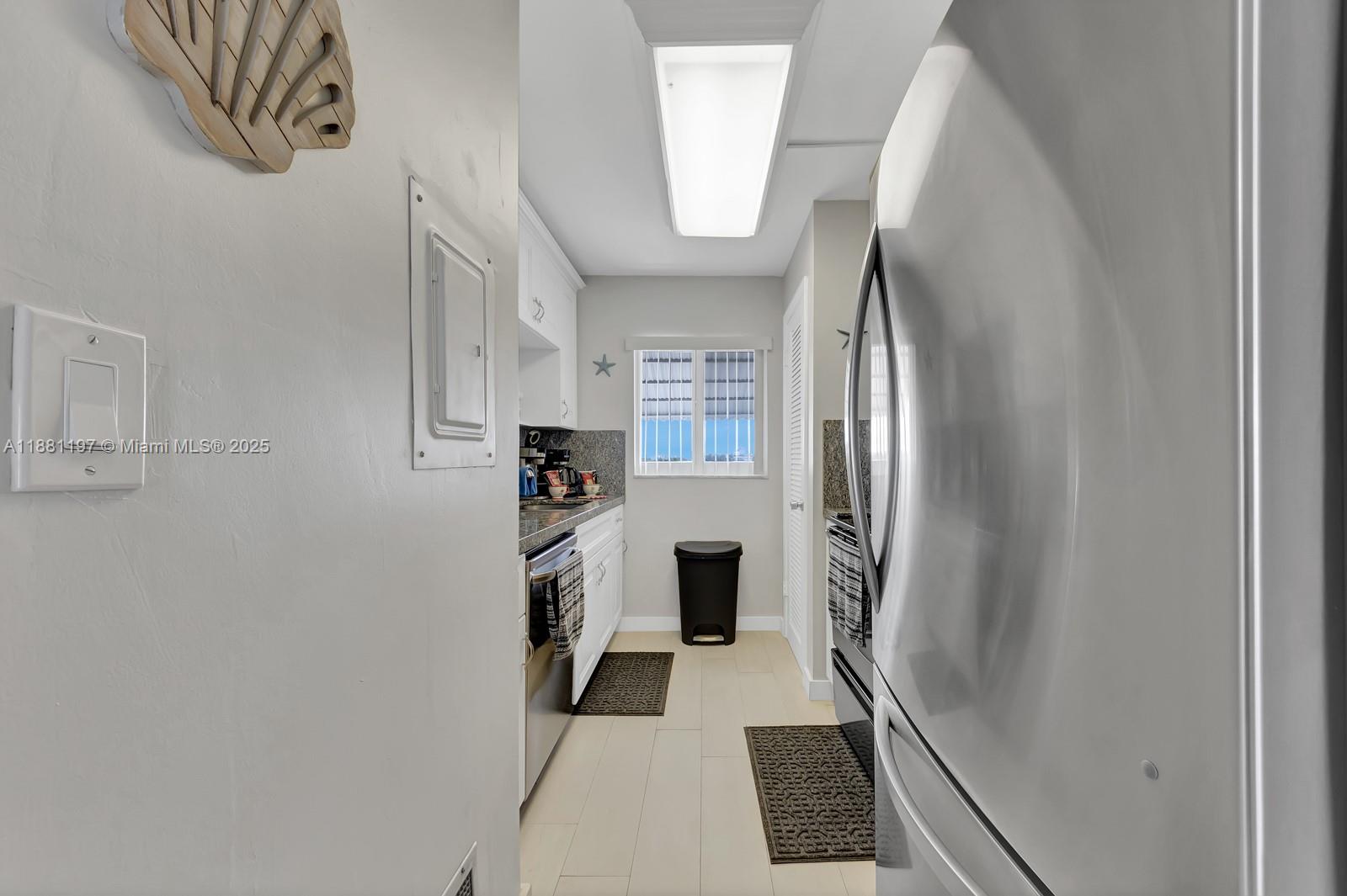 308 Sombrero Beach Road Marathon, FL 33050 - Photo 9 of 43 a view of a kitchen from the hallway