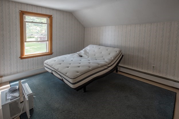 40 Ryan Road Northampton, MA 01062 - Photo 16 of 19 a bed sitting in a room next to a window