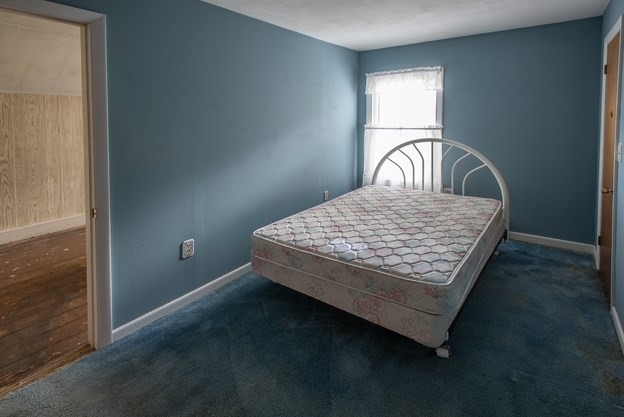 40 Ryan Road Northampton, MA 01062 - Photo 17 of 19 a bed sitting in a bedroom next to a window