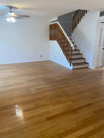 a view of room with wooden floor