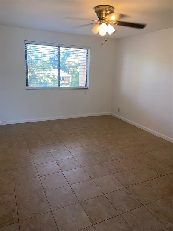 5201 Northeast 14th Terrace, Unit 3 Fort Lauderdale, FL 33334 - Photo 5 of 11 a view of an empty room with a window