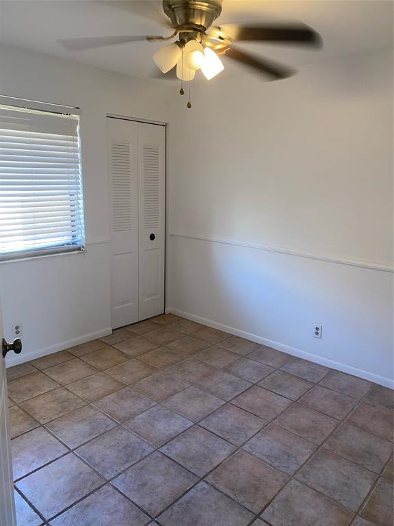 5201 Northeast 14th Terrace, Unit 3 Fort Lauderdale, FL 33334 - Photo 7 of 11 a view of a room with a fan and a window