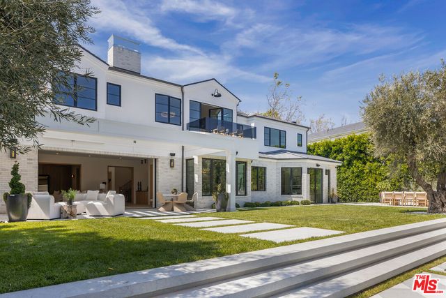 a view of a house with a swimming pool