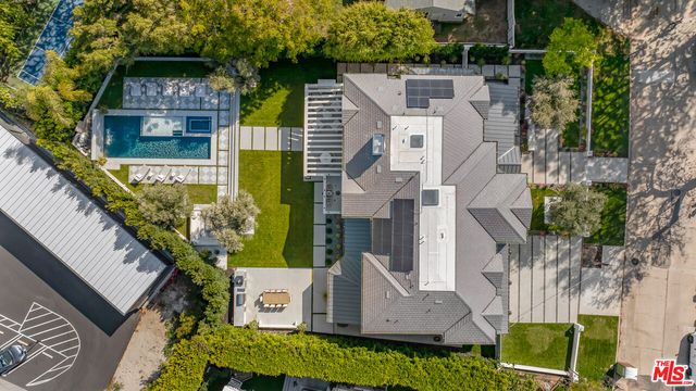 an aerial view of a house with a garden