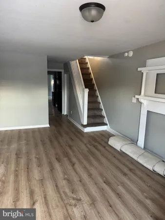 a view of a livingroom with wooden floor