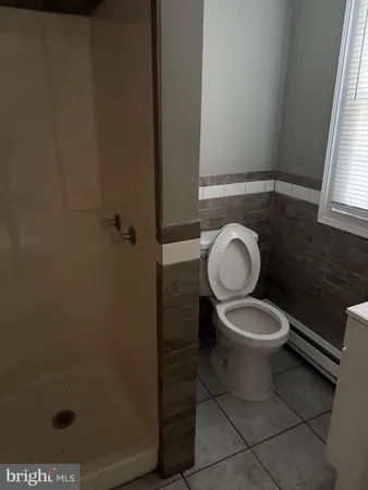 a bathroom with a toilet and a sink