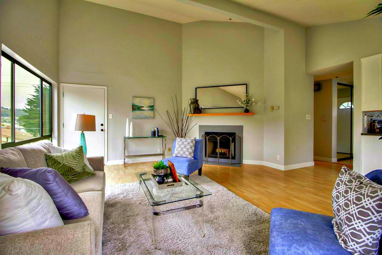 207 Monterey Road, Unit 7 Pacifica, CA 94044 - Photo 11 of 34 a living room with furniture and a fireplace