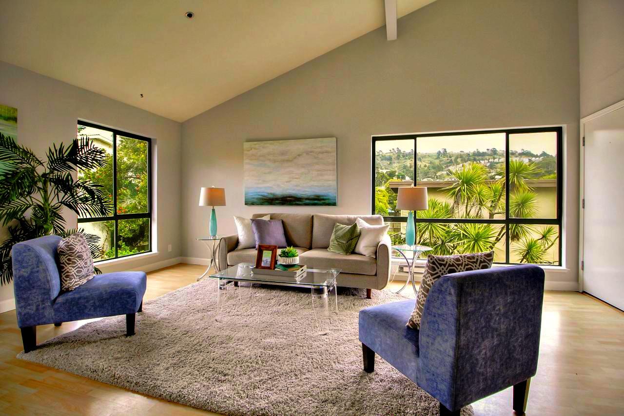 207 Monterey Road, Unit 7 Pacifica, CA 94044 - Photo 12 of 34 a living room with furniture and a large window