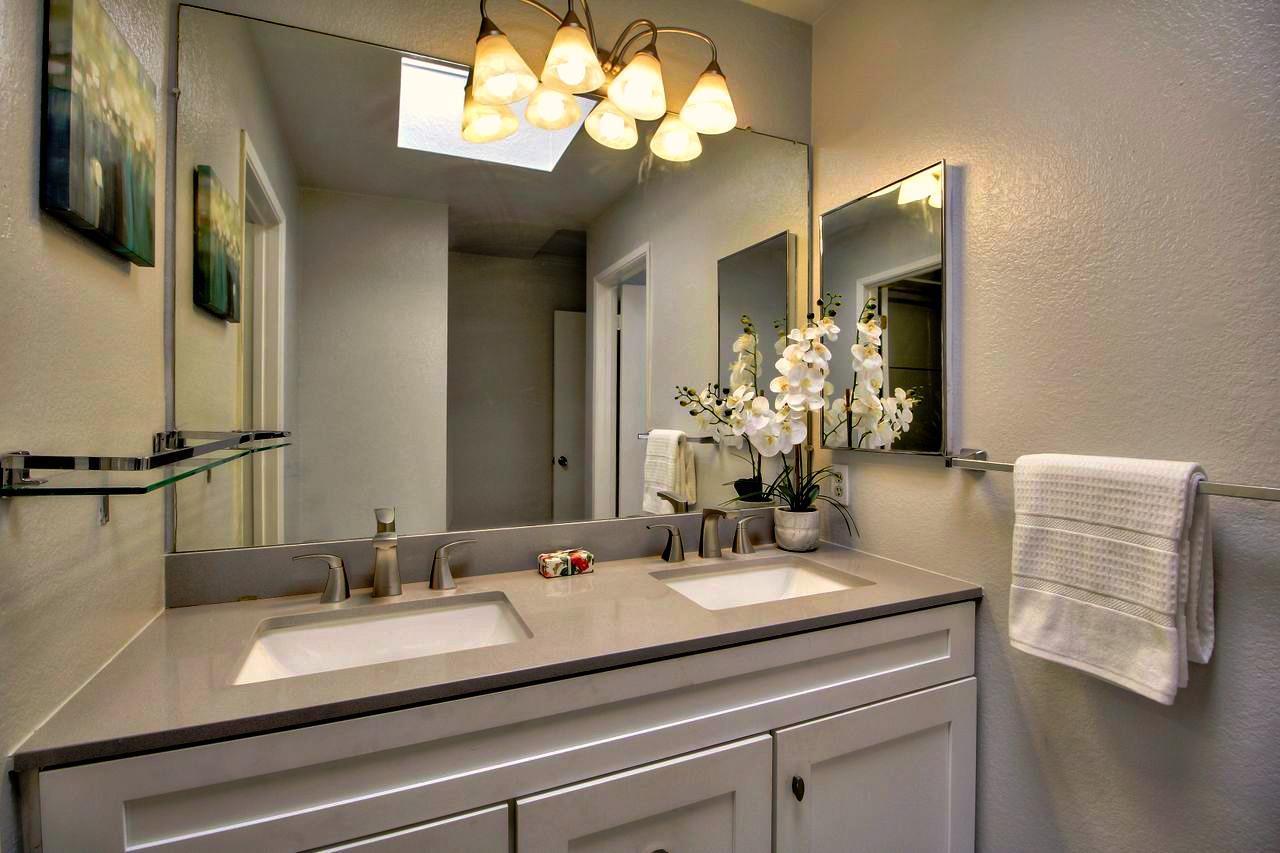 207 Monterey Road, Unit 7 Pacifica, CA 94044 - Photo 15 of 34 a bathroom with a sink vanity and a mirror