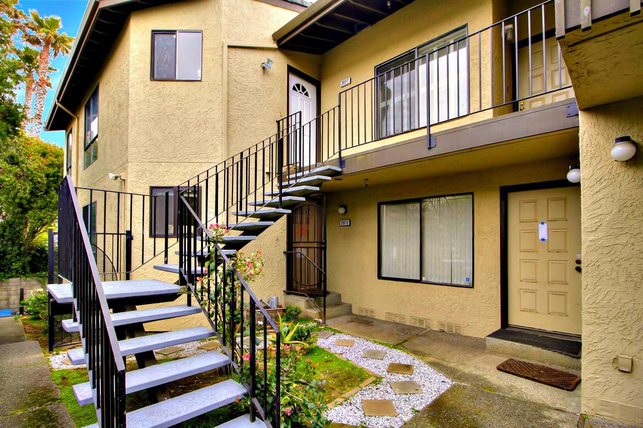 207 Monterey Road, Unit 7 Pacifica, CA 94044 - Photo 2 of 34 a view of front door of house with stairs