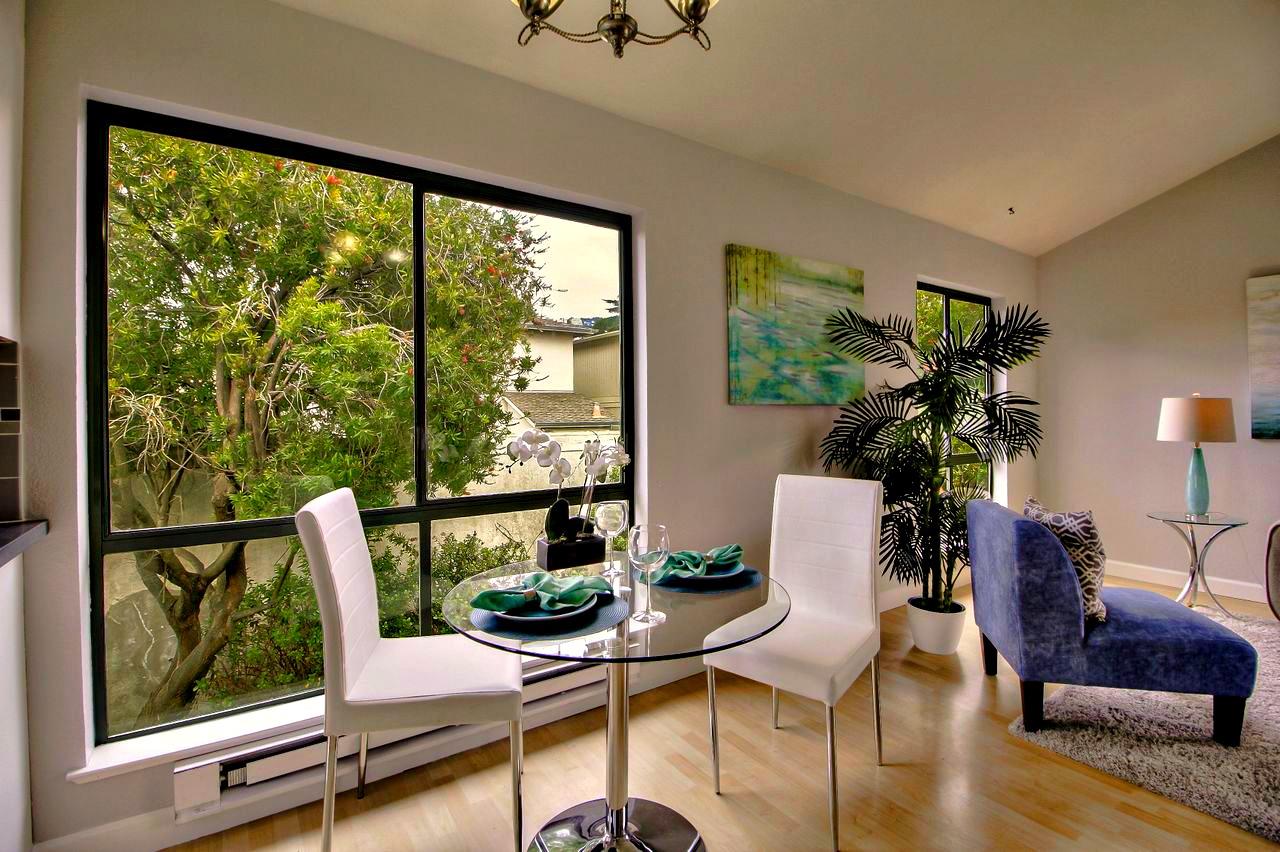 207 Monterey Road, Unit 7 Pacifica, CA 94044 - Photo 7 of 34 a living room with furniture and a window