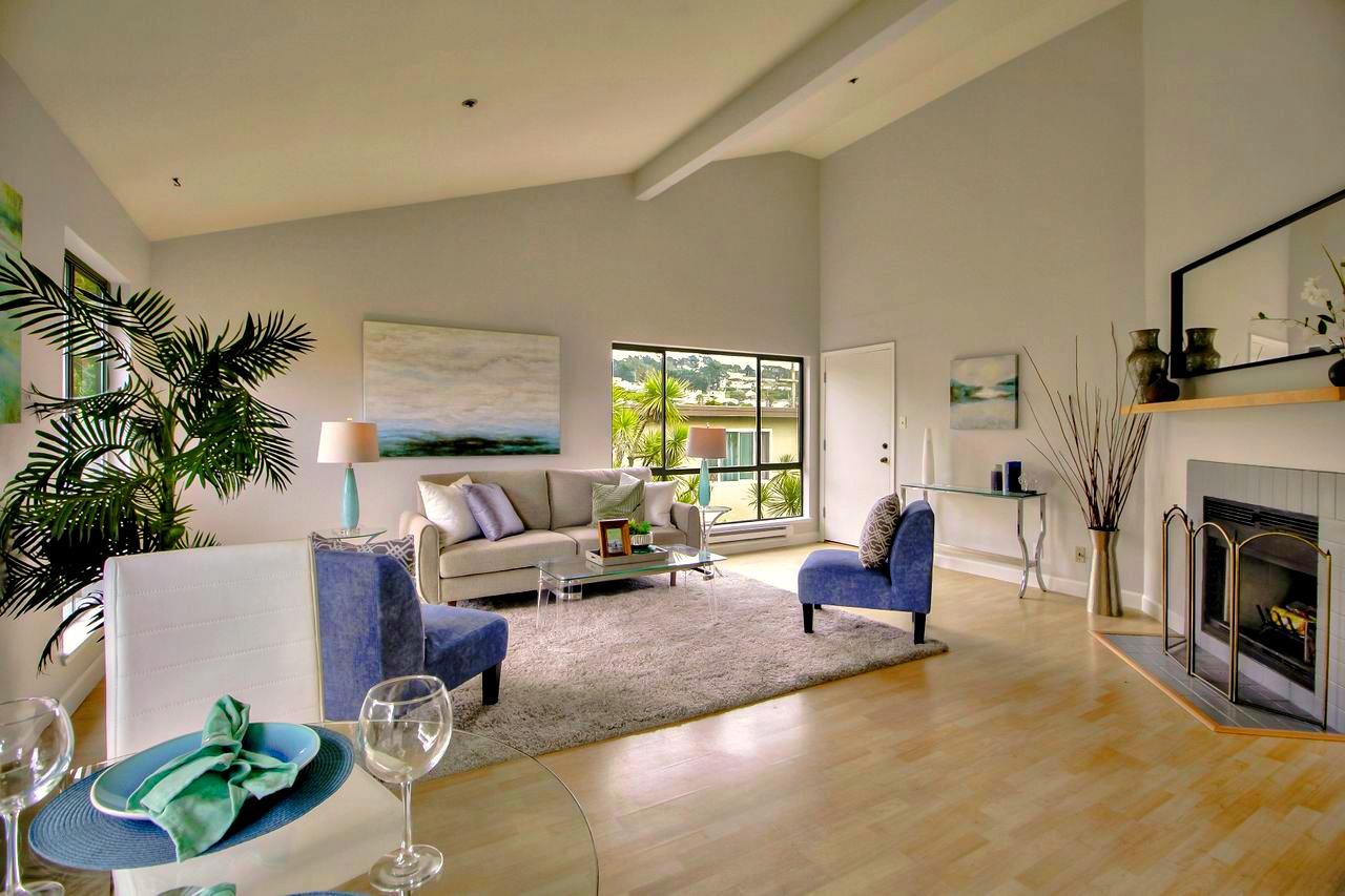 207 Monterey Road, Unit 7 Pacifica, CA 94044 - Photo 9 of 34 a living room with furniture or couch and a fireplace