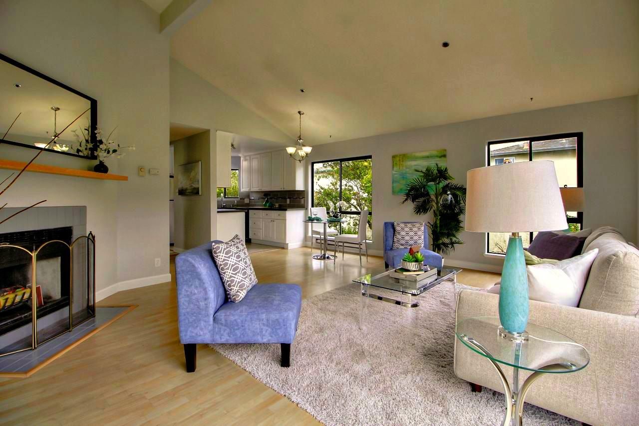 207 Monterey Road, Unit 7 Pacifica, CA 94044 - Photo 10 of 34 a living room with furniture and a fireplace