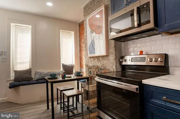 a kitchen with a stove and a microwave