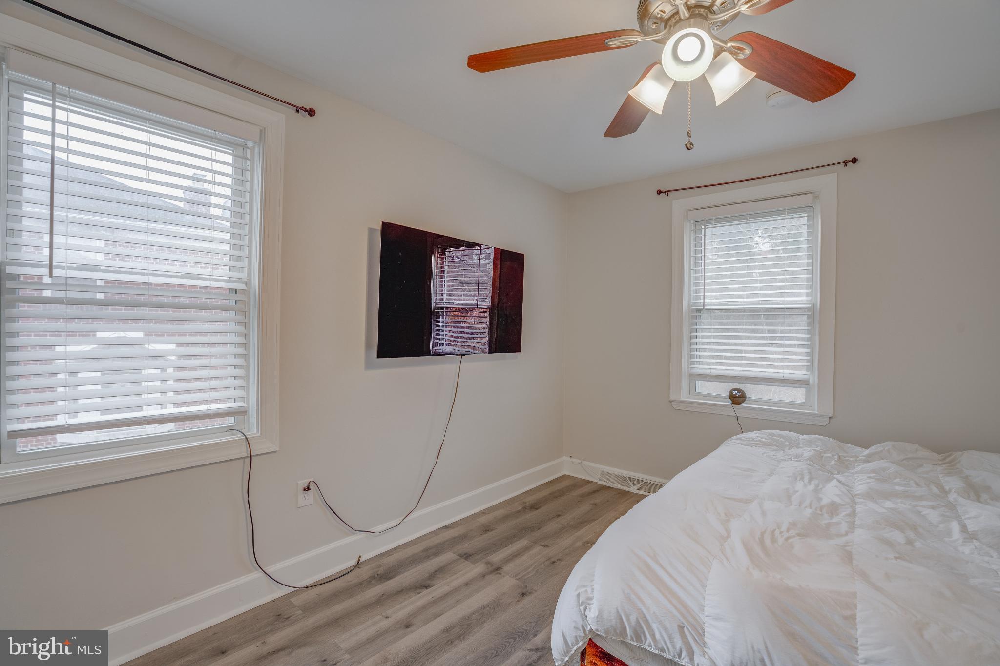 4814 Briarclift Road Baltimore, MD 21229 - Photo 13 of 34 a bedroom with a large bed and a window