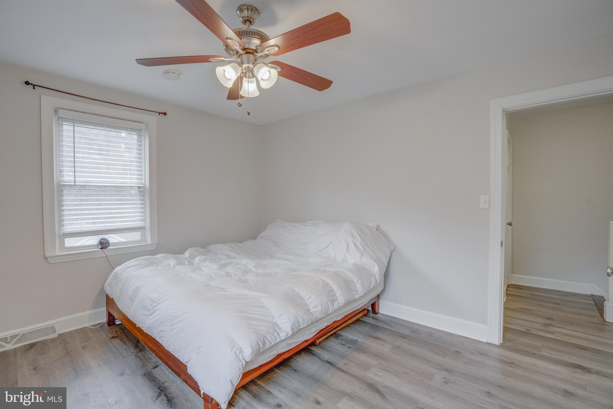 4814 Briarclift Road Baltimore, MD 21229 - Photo 14 of 34 a bedroom with a bed and a window