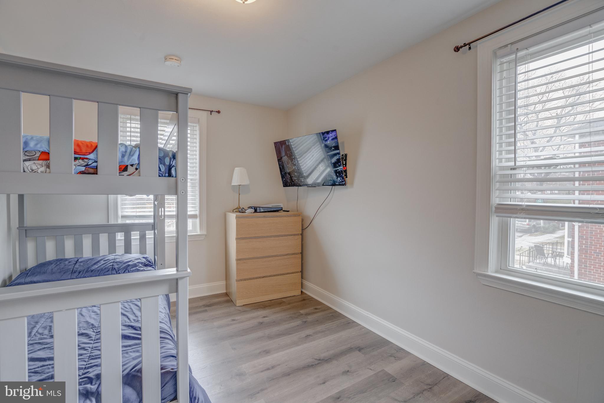 4814 Briarclift Road Baltimore, MD 21229 - Photo 20 of 34 a bedroom with furniture and wooden floor
