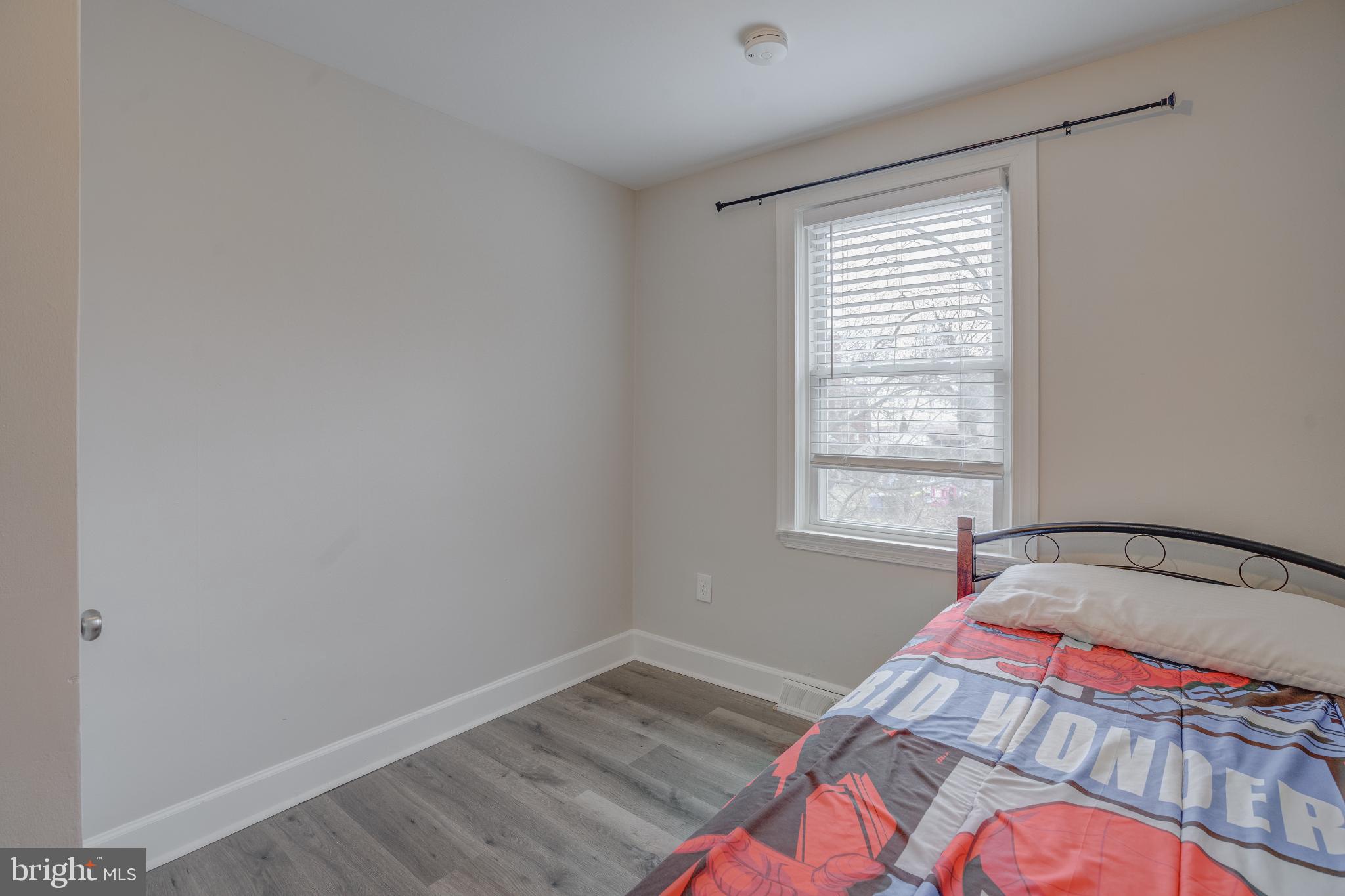 4814 Briarclift Road Baltimore, MD 21229 - Photo 21 of 34 a bedroom with a bed and a window
