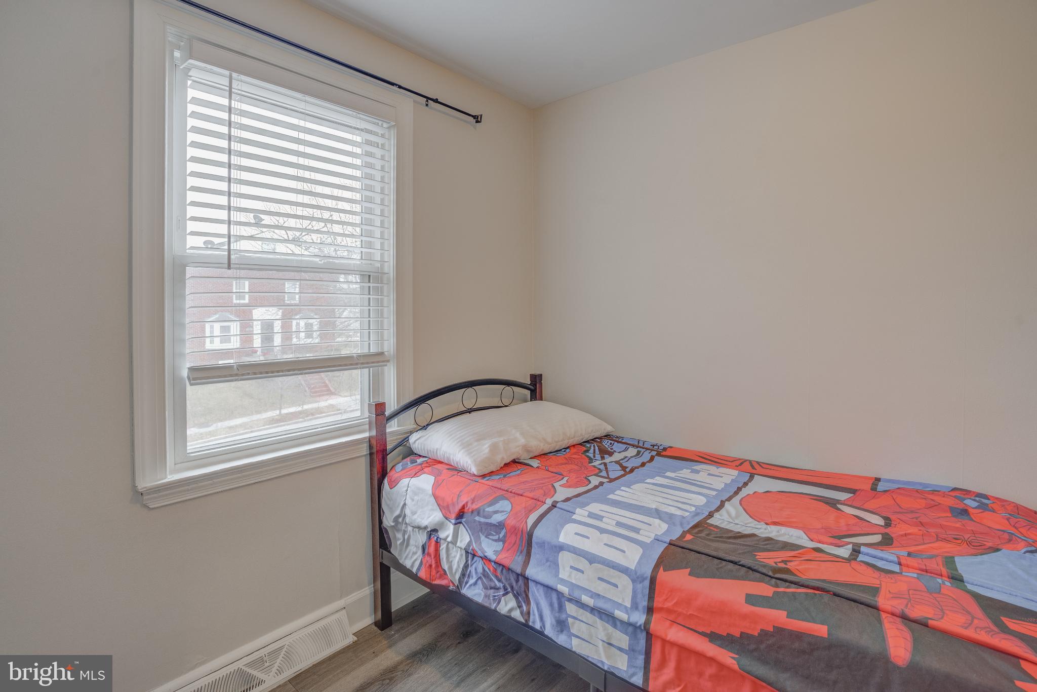 4814 Briarclift Road Baltimore, MD 21229 - Photo 22 of 34 a bedroom with a bed and a window