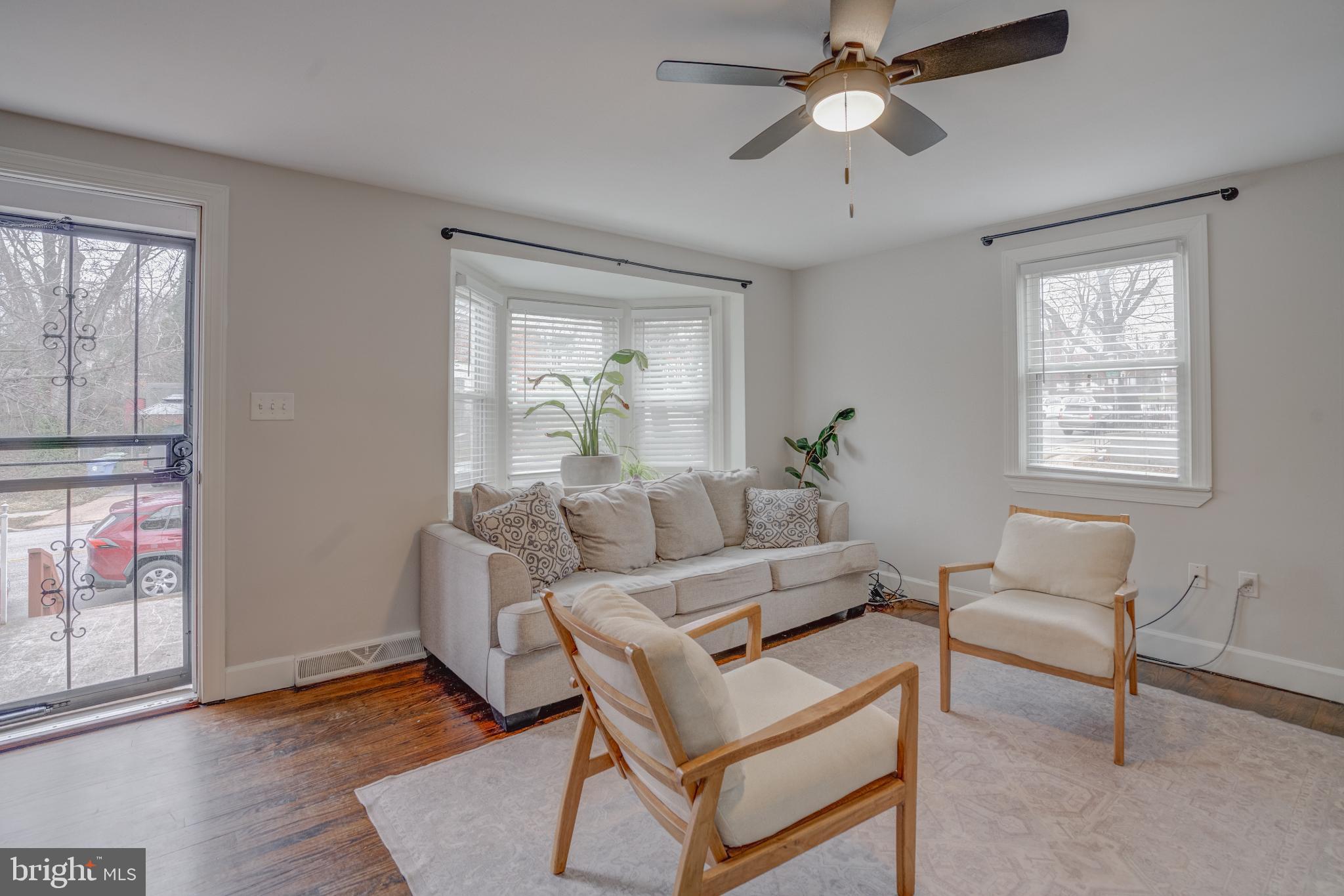 4814 Briarclift Road Baltimore, MD 21229 - Photo 4 of 34 a living room with furniture and a window