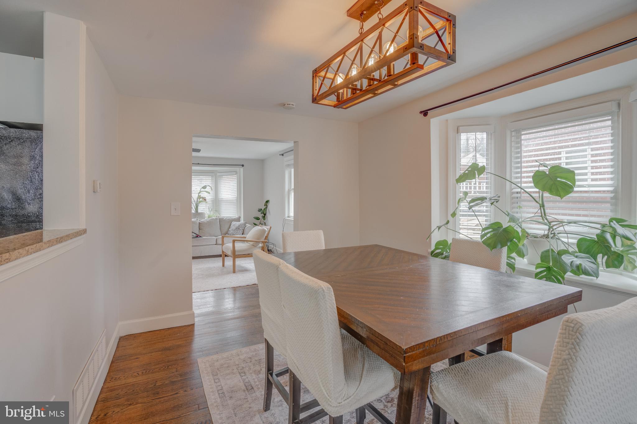 4814 Briarclift Road Baltimore, MD 21229 - Photo 8 of 34 a view of a dining room with furniture and a potted plant