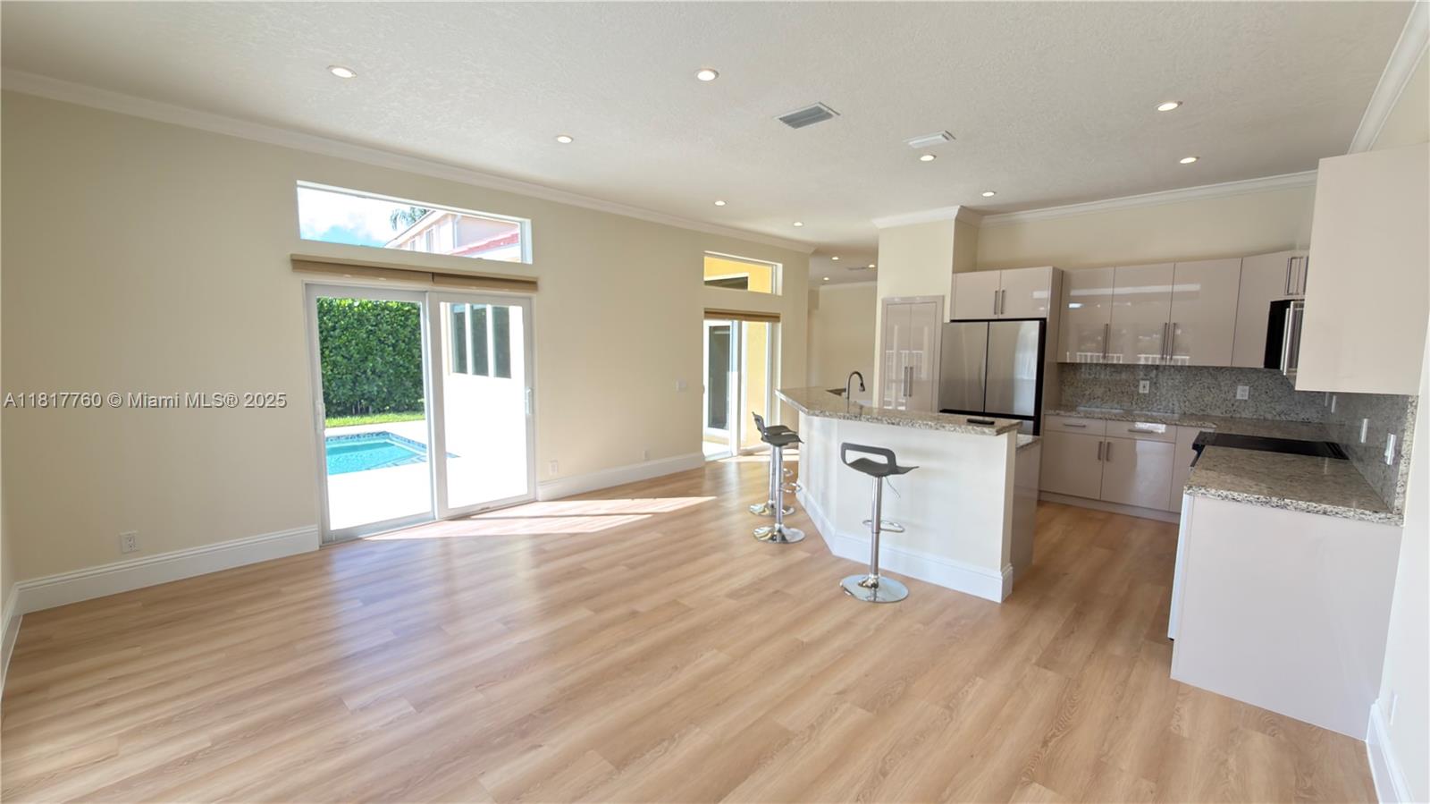 4221 Laurel Ridge Circle Weston, FL 33331 - Photo 13 of 57 a view of a kitchen with refrigerator stove and wooden floor
