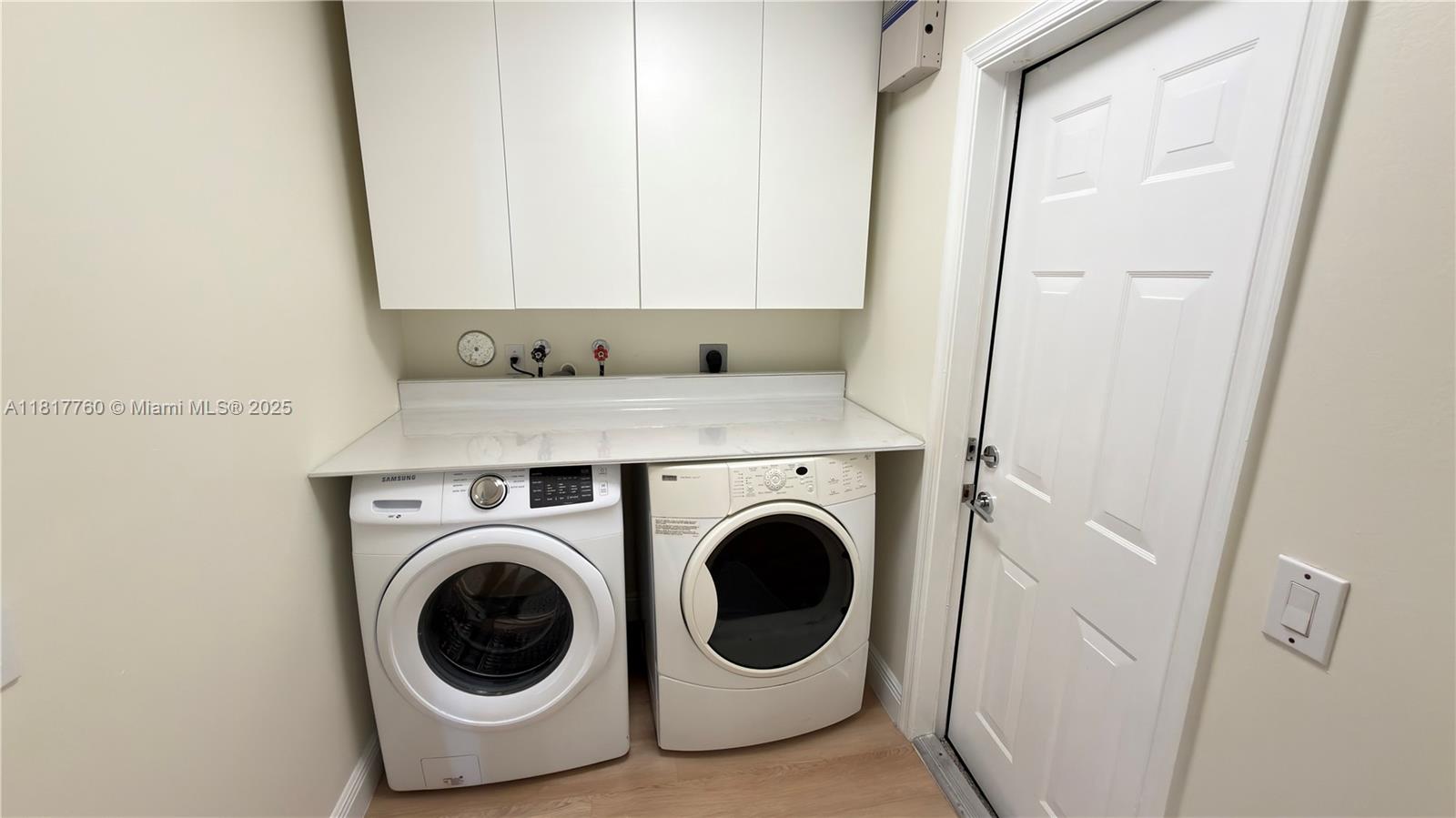 4221 Laurel Ridge Circle Weston, FL 33331 - Photo 34 of 57 a utility room with dryer and washer