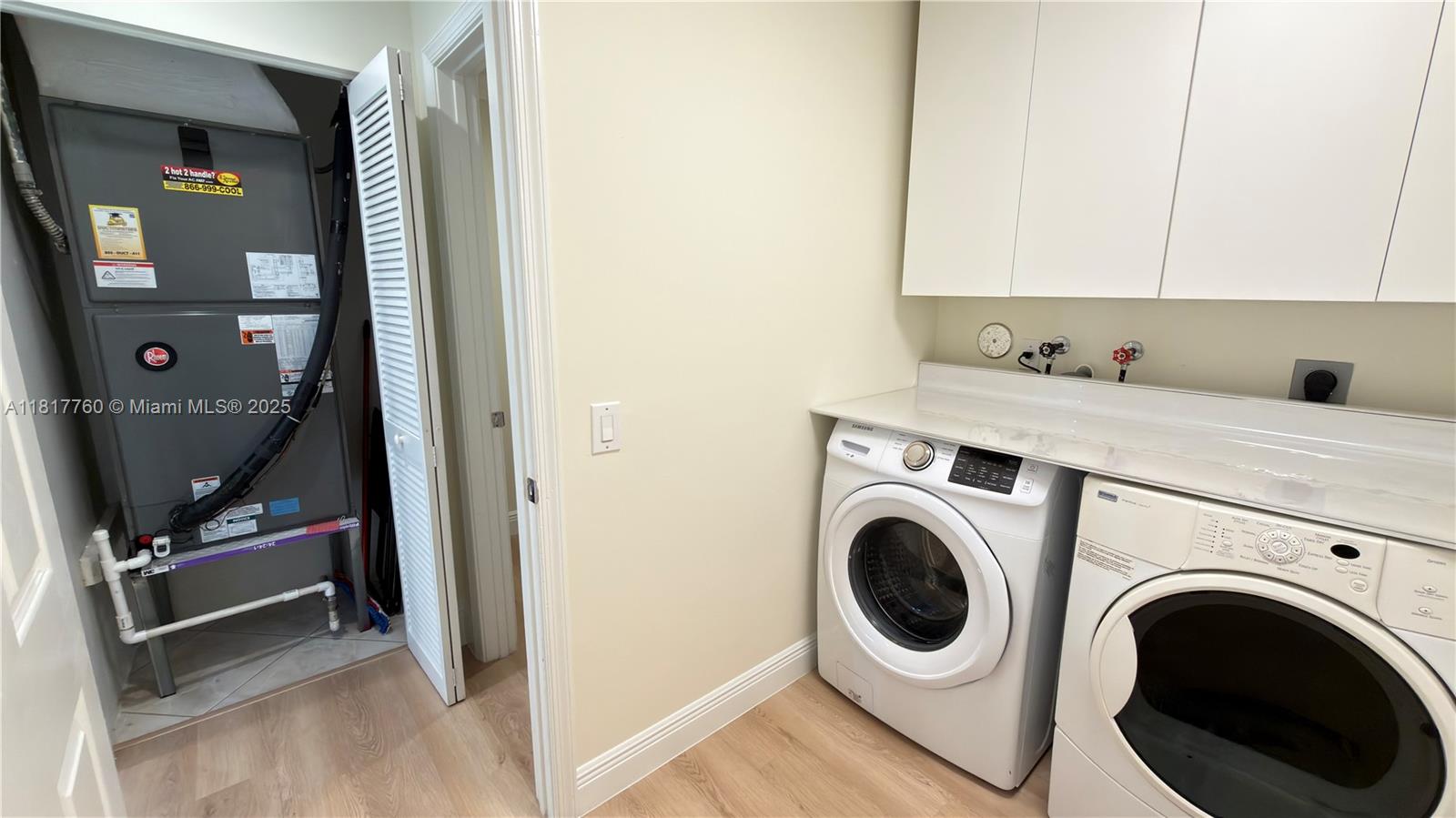 4221 Laurel Ridge Circle Weston, FL 33331 - Photo 35 of 57 a utility room with dryer and washer