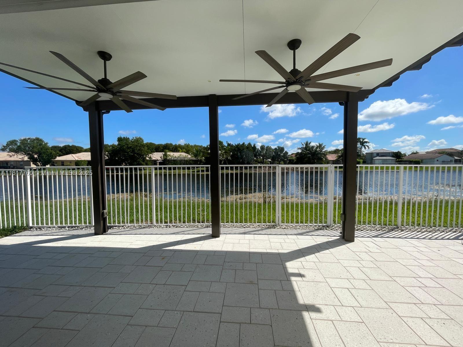 4221 Laurel Ridge Circle Weston, FL 33331 - Photo 6 of 57 a view of a deck with a floor to ceiling a yard