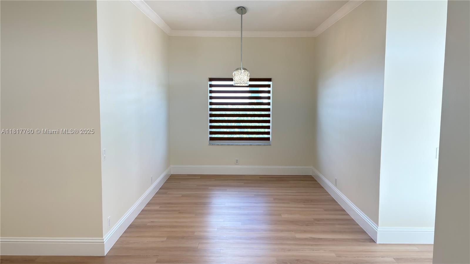 4221 Laurel Ridge Circle Weston, FL 33331 - Photo 9 of 57 a view of empty room with wooden floor and fan