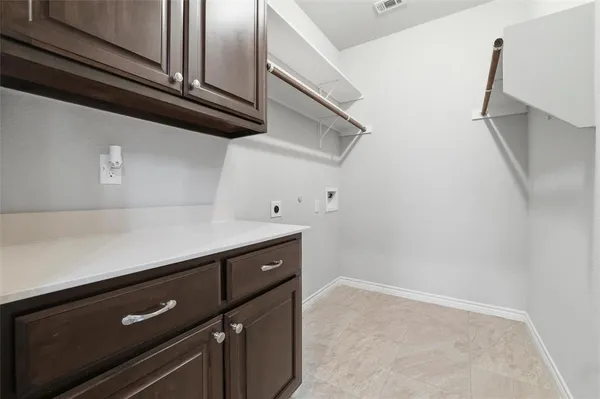 a view of a microwave and an empty room