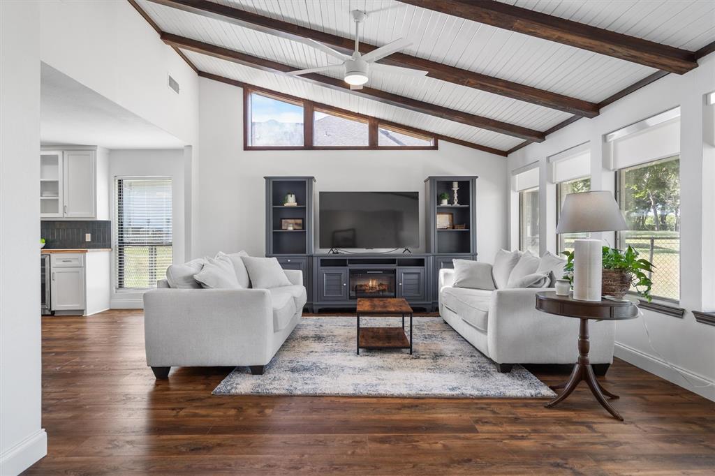 117 Modoc Trail Lake Kiowa, TX 76240 - Photo 7 of 40 Oversized Family Room offer custom finishes with beams and natural light.