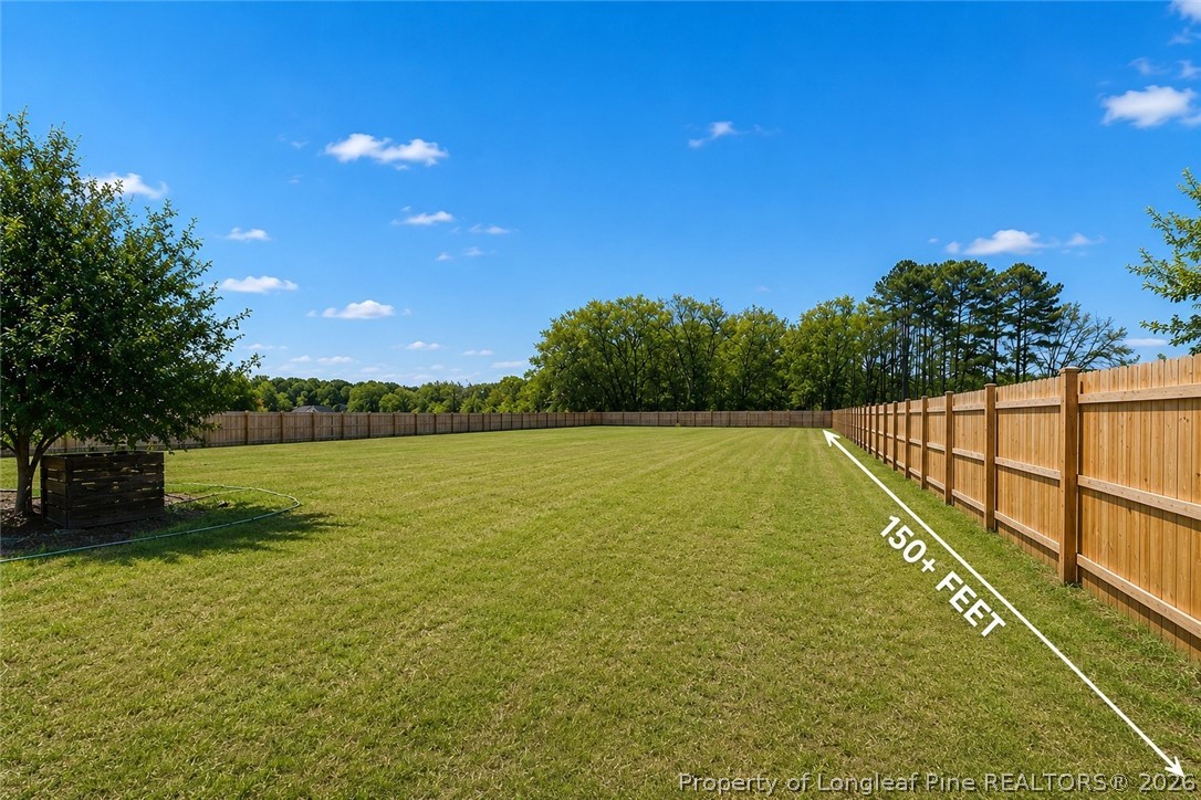 466 Ralph Hunt Boulevard Orrum, NC 28369 - Photo 15 of 17 a view of a lake from a yard