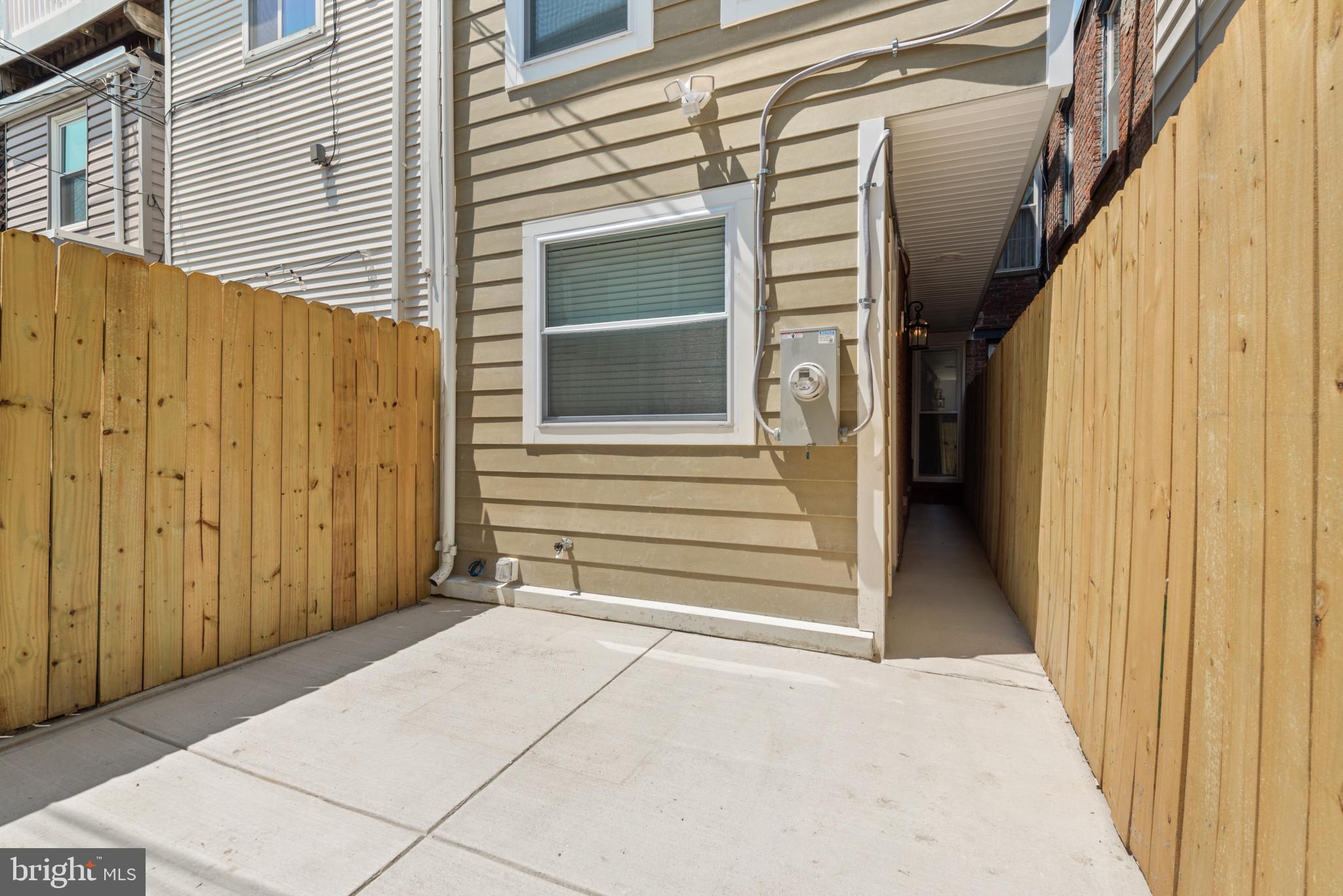 1005 Riverside Avenue Baltimore, MD 21230 - Photo 14 of 29 a view of a house with a door and a window