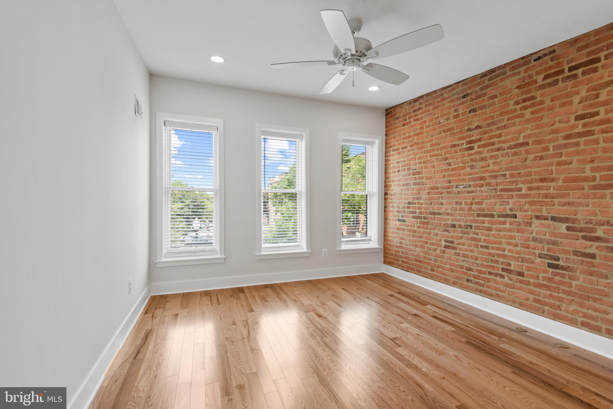 1005 Riverside Avenue Baltimore, MD 21230 - Photo 18 of 29 wooden floor in an empty room with a window