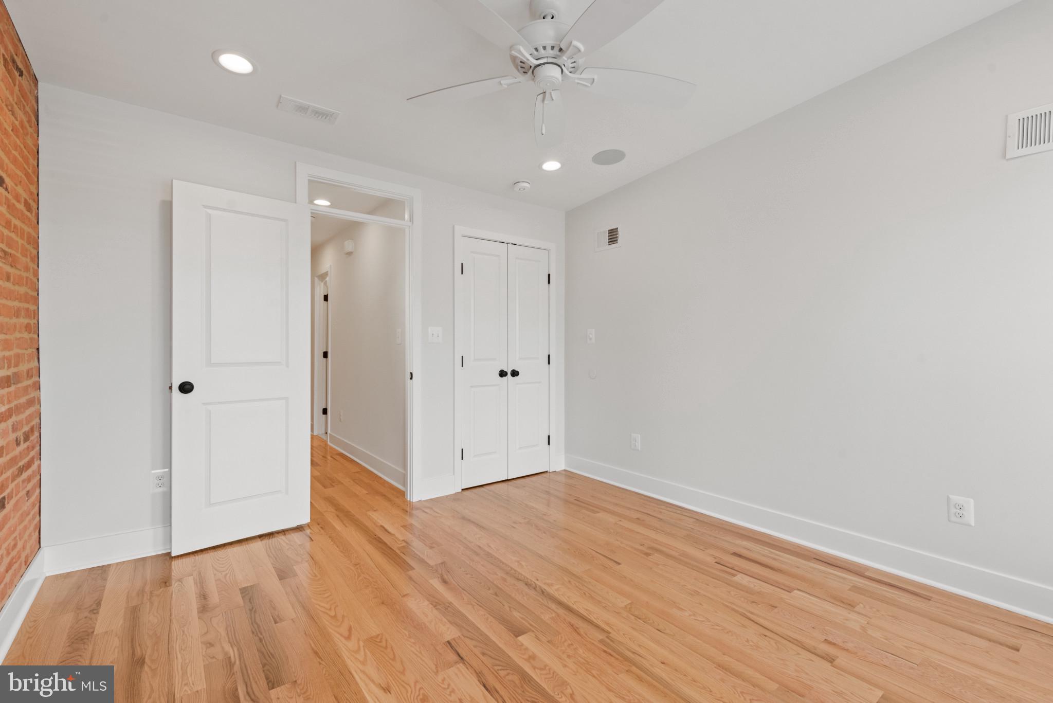 1005 Riverside Avenue Baltimore, MD 21230 - Photo 20 of 29 a view of an empty room with wooden floor