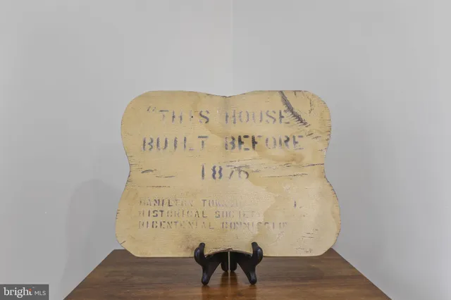 a sign on a wall next to a wall