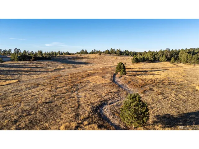a view of a lake with houses in the background