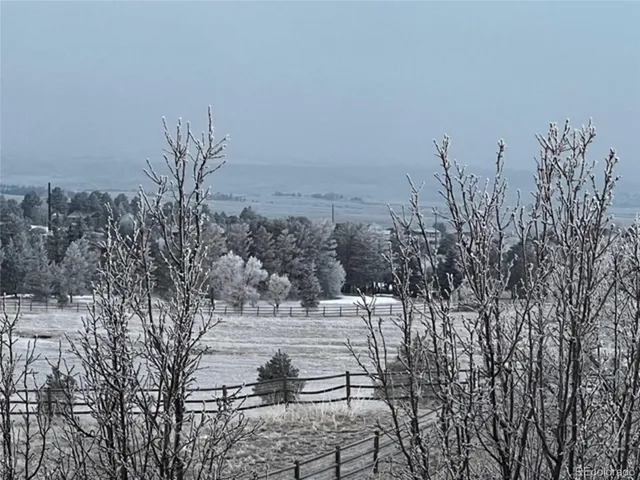 a view of a covered with snow in the background