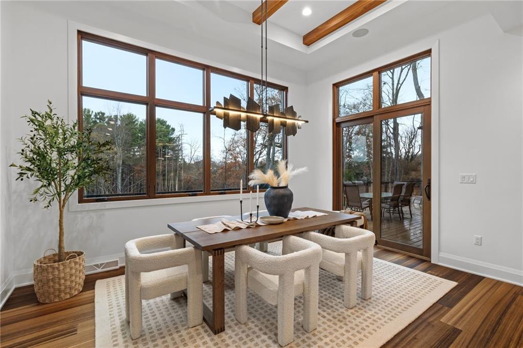 10485 Grubbs Road Wexford, PA 15090 - Photo 11 of 50 The dining room features Hubbardton Forge Ardesia Linear chandelier with slate detail. Access to side covered patio with custom gas fireplace.