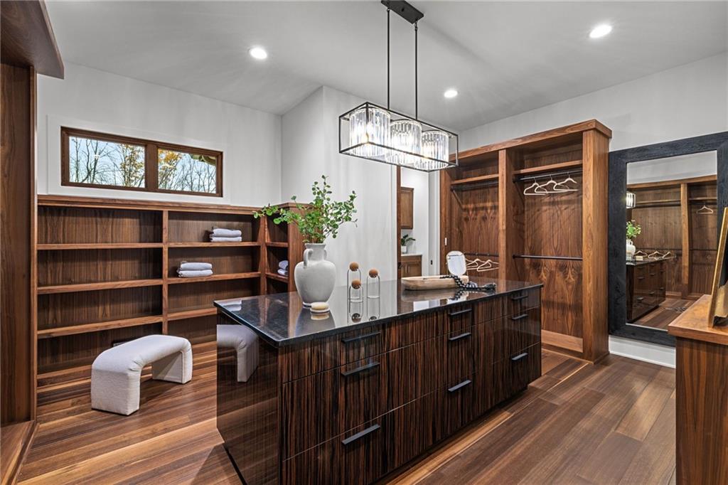 10485 Grubbs Road Wexford, PA 15090 - Photo 26 of 50 Primary dressing room closet with custom-built boutique-style walnut closet system.